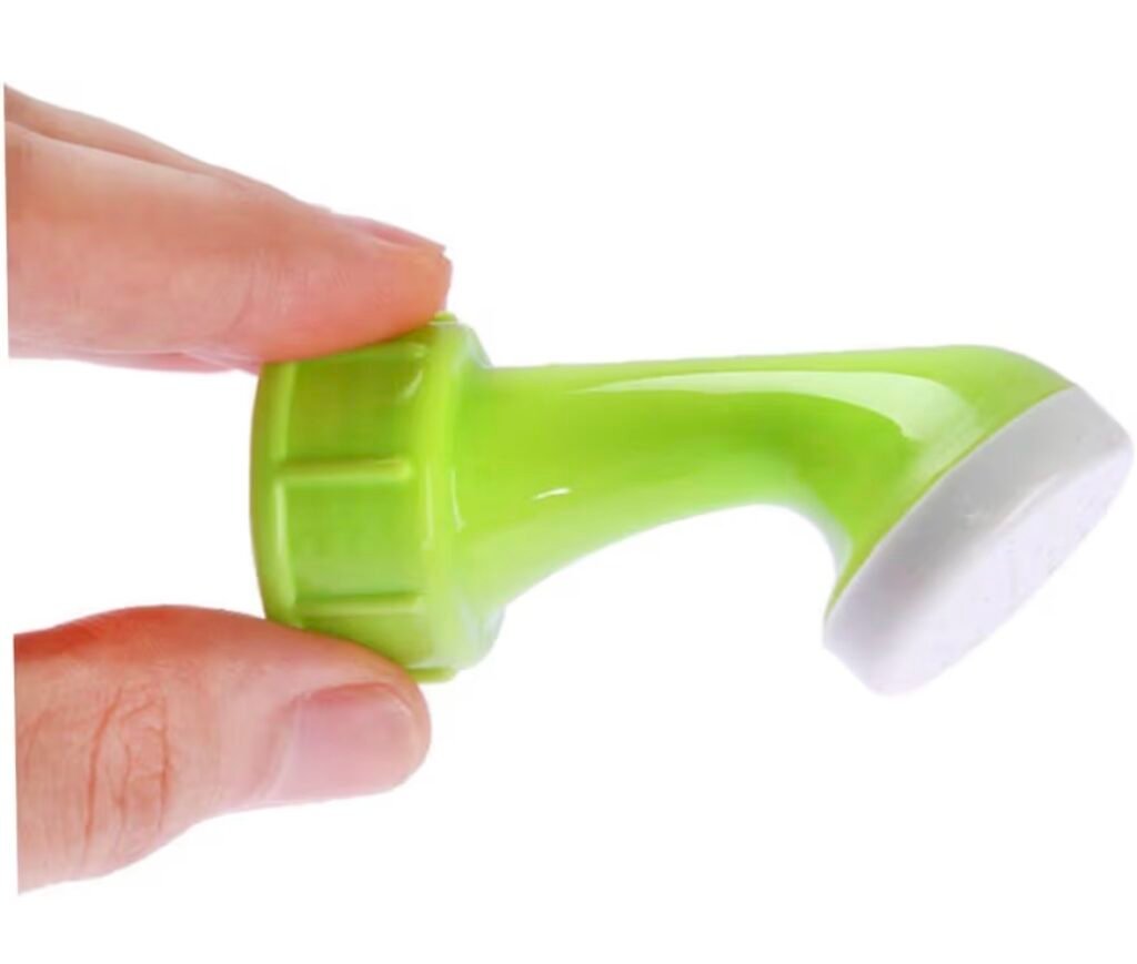 Woman using a bottle top sprinkler to water potted plants eas